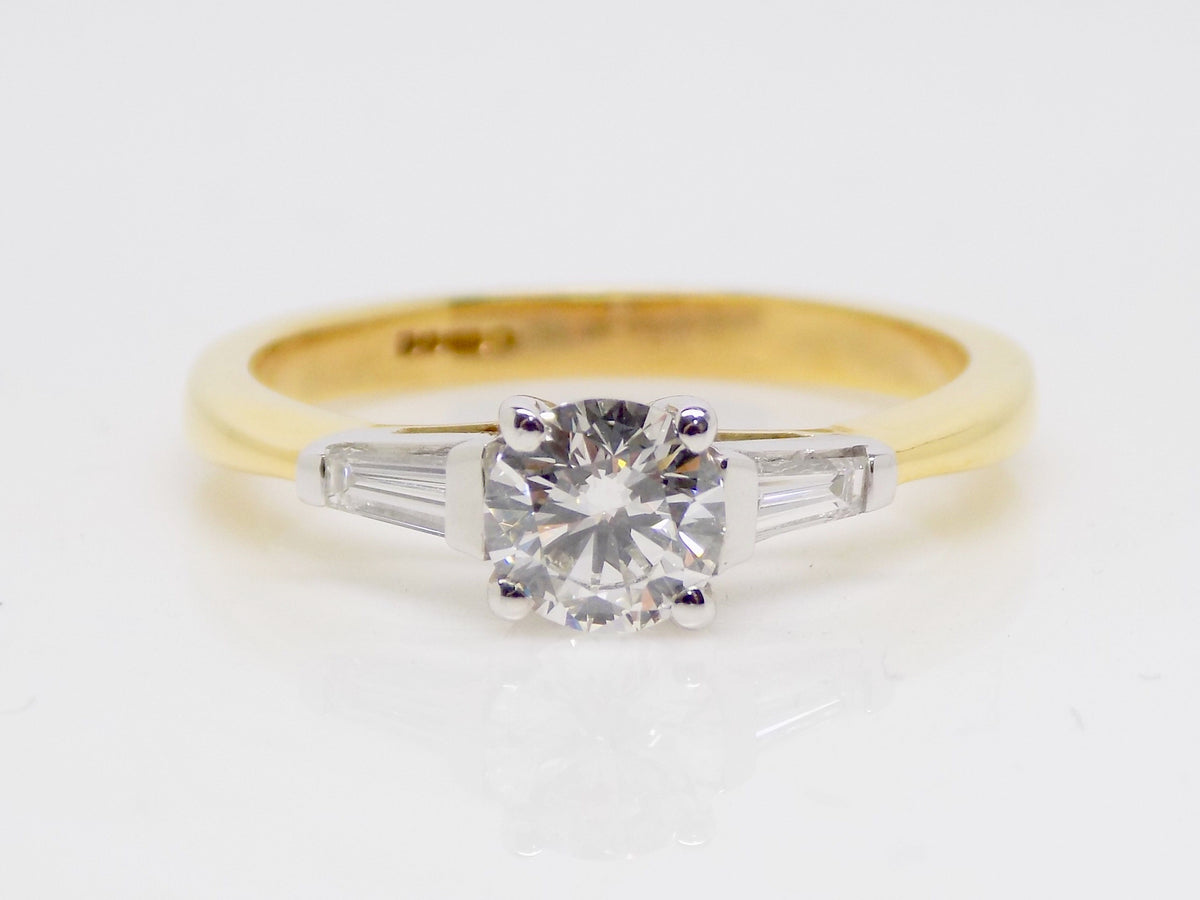 Solitaire diamond ring with on sale baguettes