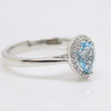 9ct White Gold Pear Shape Blue Topaz Diamond Halo Ring SKU 5506005