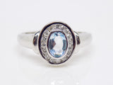 9ct White Gold Rubover Oval Aquamarine Diamond Halo Ring SKU 5206010