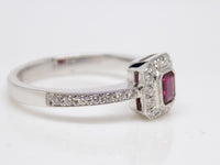 18ct White Gold Emerald Cut Ruby & Diamond Halo/Shoulders Engagement Ring 0.36ct SKU 8802094