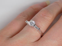 18ct White Gold Round Brilliant Centre Diamond Baguette Side Diamonds Engagement Ring 0.75ct SKU 8803014