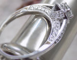 18ct White Gold Round Brilliant Diamond Halo Engagement Ring 0.50ct SKU 8802122